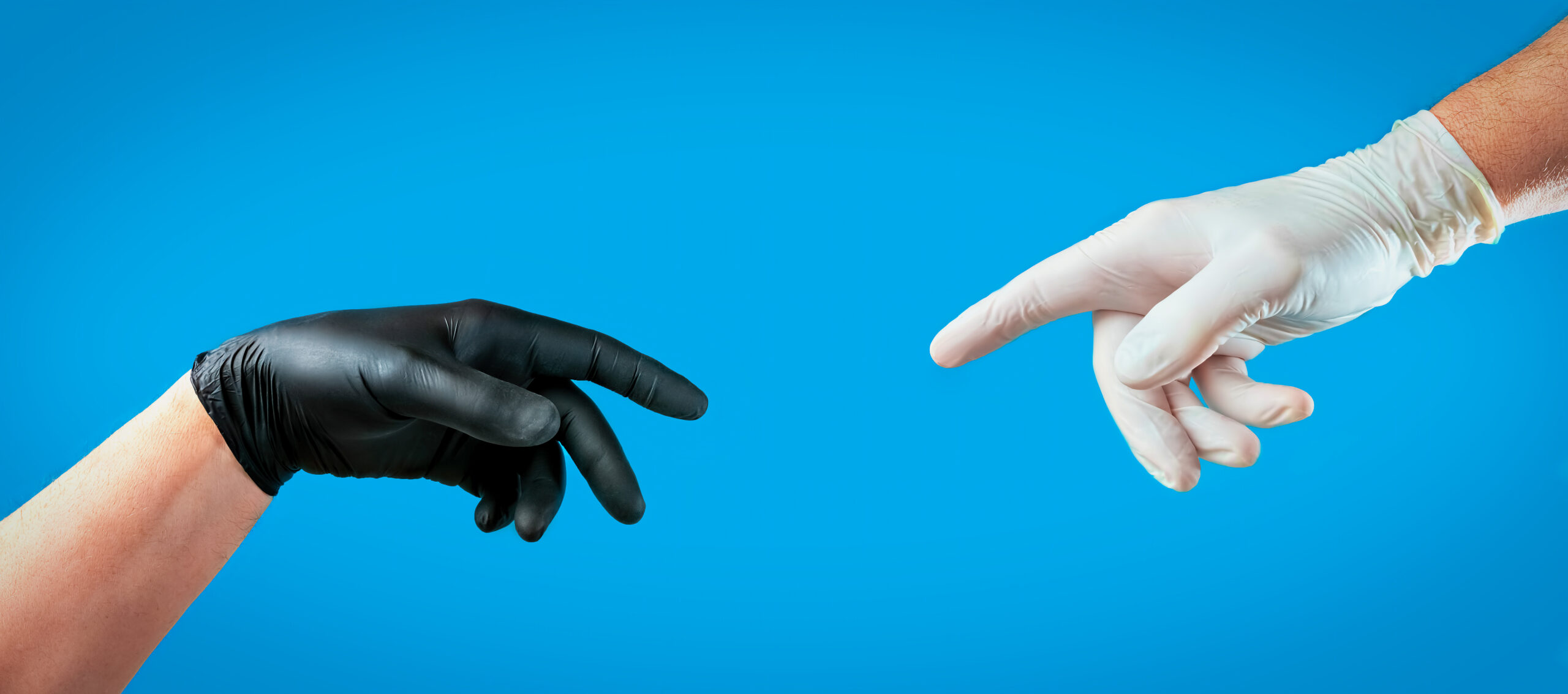 Male hands with gloves, concept from coronavirus - COVID-19. Gloves as personal protective equipment, vinyl disposable gloves against the spread of viruses and protection against infections. Latex rukavice bez pudera
